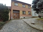 1/2 rodinného domu s pozemky